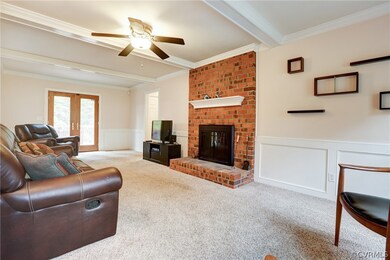Family Room with Carpet, Beamed Ceiling, Ceiling F