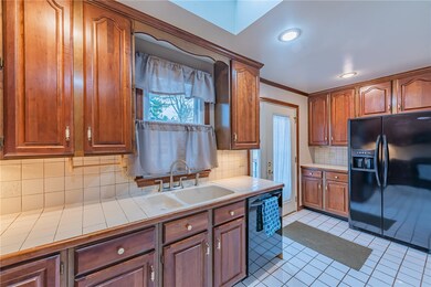 Kitchen area, access to back deck area, back yard.