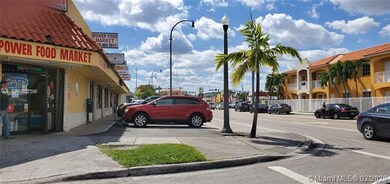 Corner stores on Palm Ave looking south from E. 10