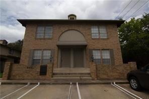 View of building exterior featuring uncovered par