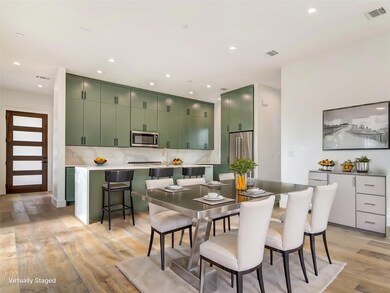 Dining room with light wood finished floors and r
