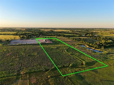 Aerial view of property and surrounding area with property boundaries highlighted