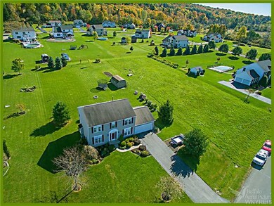 Aerial View 4 Bedroom Home on approx 3/4 acres Bos