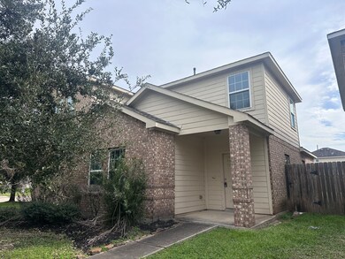This is a two-story home with a combination of bri