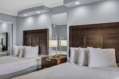 Bedroom featuring recessed lighting and crown mold