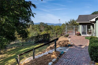 Walkway to the front door with fenced area for you
