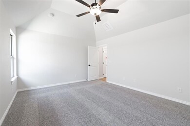 Spare room featuring a ceiling fan, carpet flooring, baseboards, a smoke detector, and high vaulted ceiling