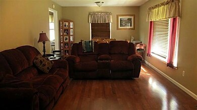 Spacious living room features hardwood flooring.