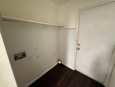Washroom featuring hookup for a washing machine, 