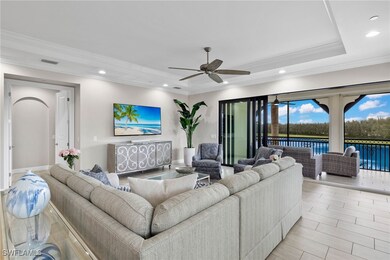 Great Room featuring a tray ceiling, crown molding