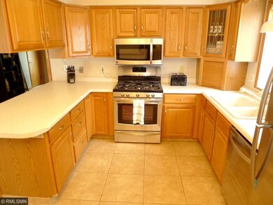 Kitchen w/ raised panel oak cabinets & newer S.S. 