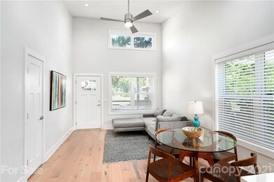 Open Living Floor Plan with Vaulted Ceilings, Wide Planked Hardwood Floor and Modern Fixtures