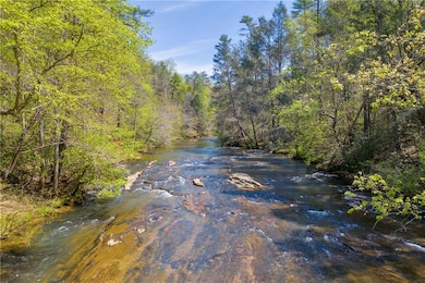 Water view featuring a wooded view