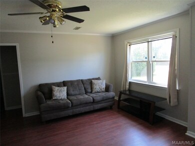 Living room looking to other two bedrooms and bath