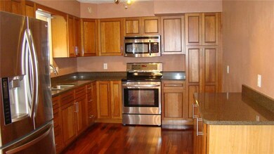 Updated kitchen /diningroom combo features granite counters, stainless appliances, pantry and ceilingfan