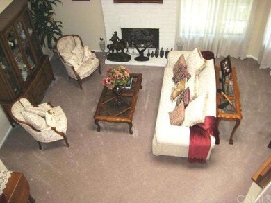 Enormous formal living room with skylight.  It lig