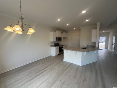 Kitchen with light wood-type flooring, appliances 