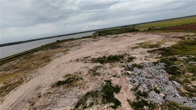 Aerial view of sparsely populated area with a large body of water