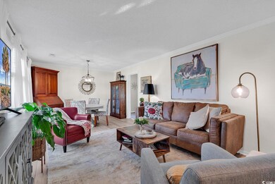 Living room with light hardwood / wood-style floor