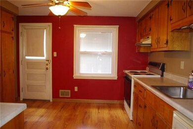 Kitchen leads to rear deck and level yard.