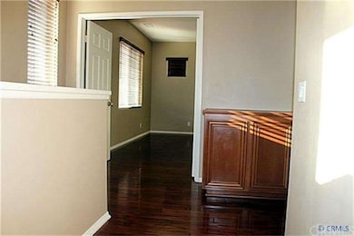 Upstairs view of master bedroom. Hallway to the ri