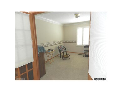View of Den/Office thru French Doors. Note Plantat