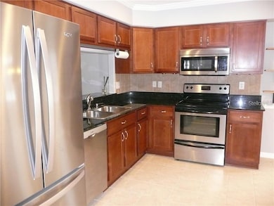 Beautiful stainless steel appliance package, wood cabinetry and lovely granite countertops grace this amazing kitchen.