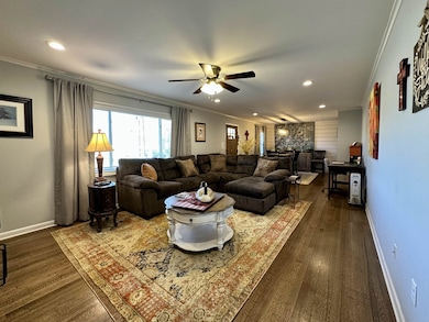 Living room featuring dark hardwood / wood-style f