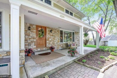 Generous covered front entry overlooking beautiful