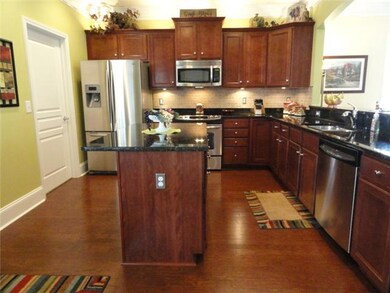 Notice the dynamics of the kitchen cabinets. One cabinet extends taller than the others with molding along the top... All Upgrades...even the knobs are upgrades.