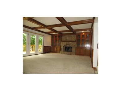 Great room with built-ins and stone fireplace