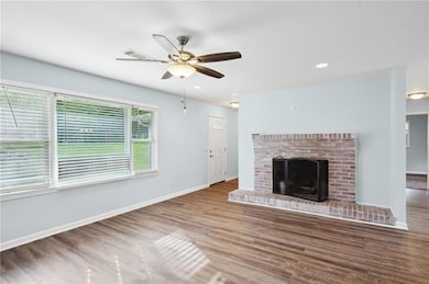 Unfurnished living room with wood finished floors,