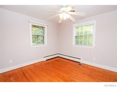 Bedroom 2 with hardwood floors & ceiling fan!