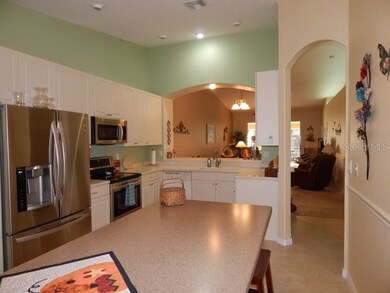 Kitchen opens with a pass-thru to dining/living ro