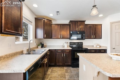 Kitchen With Gold Hardware and Updated Light Fixtures