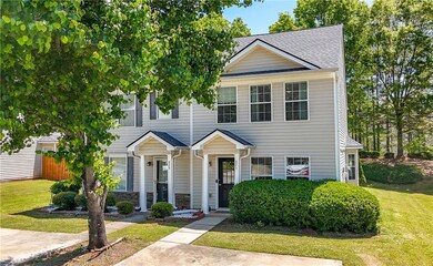 View of front of home with a front yard, fence, a 