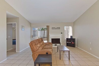 Spacious living room with fireplace for entertainm