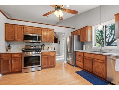 Lots of oak cabinets and new stainless steel appli