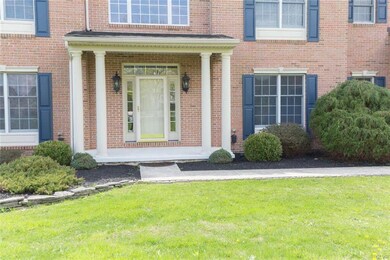 Brick exterior and covered front porch greet you