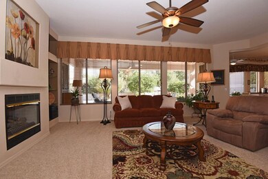 Great room w/wall of windows.