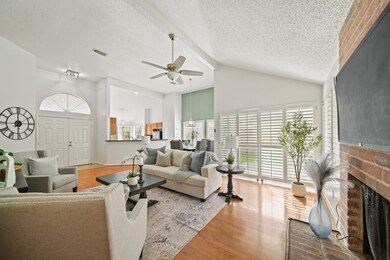 The family room is bathed in soft natural light fr