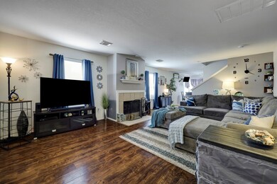 Open livingroom with wood laminate flooring