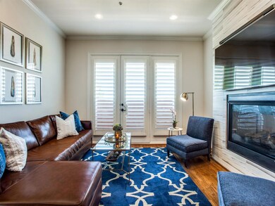 Living room has hardwoods and marble fireplace upg