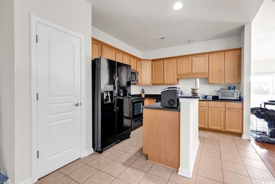 Kitchen featuring stainless steel microwave, a cen