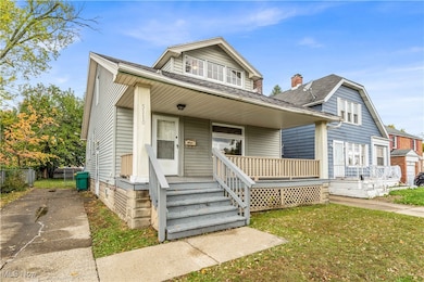 Bungalow-style house featuring a porch, a front yard, a chimney, and a shingled roof