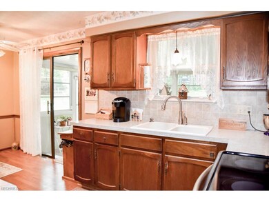 Kitchen has ample cabinet space and a pantry.