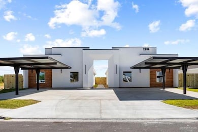Contemporary home featuring stucco siding
