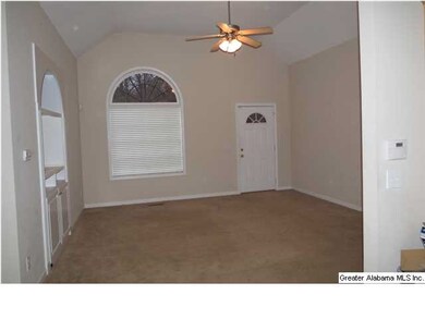 Great room with vaulted ceiling and built in's