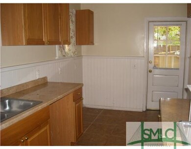 Kitchen. Note the tile floors and wainscoting.