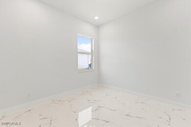 Unfurnished room with baseboards, recessed lightin